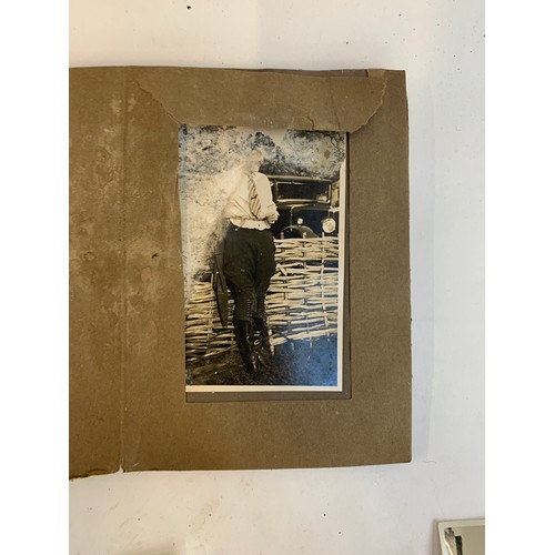 570 - A small photograph album containing 20 photographs. c.1930, mainly equestrian interest, to include B... 