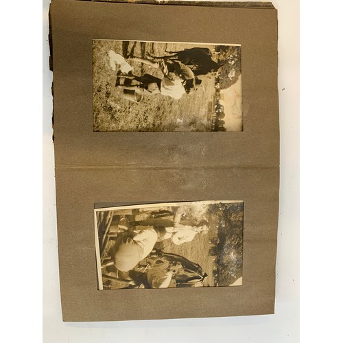 570 - A small photograph album containing 20 photographs. c.1930, mainly equestrian interest, to include B... 