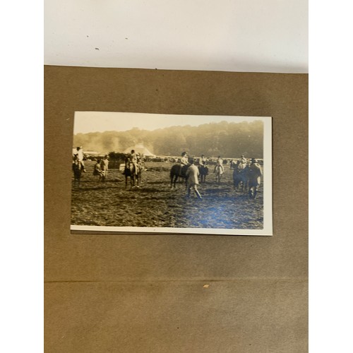 570 - A small photograph album containing 20 photographs. c.1930, mainly equestrian interest, to include B... 