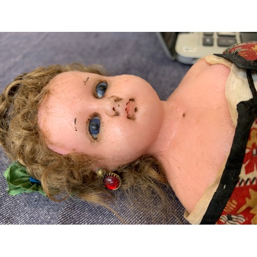 516 - A late 19th/early 20th century wax doll, 26cmL