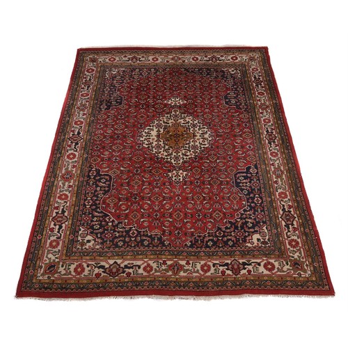 743 - A North West Persian carpet, with red ground, approx. 350x260cm