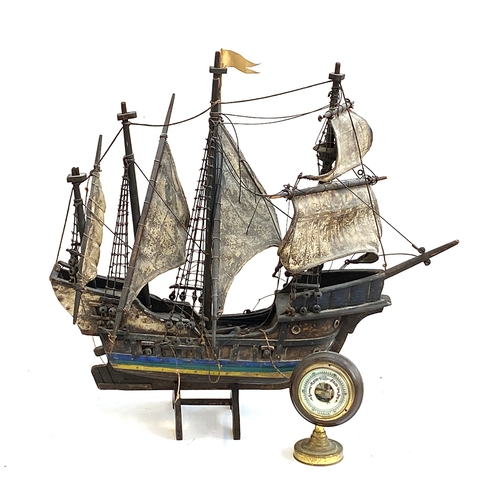 180 - A model galleon, 56cmL; together with a barometer