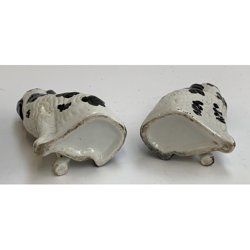 73 - A pair of mid 19th century Staffordshire dogs c.1860 (af), painted with Disraeli curls and blackberr... 