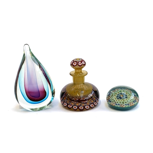 106 - A millefiori glass paperweight, 7.5cmD, together with a millefiori glass bottle, 11.5cmH, and a glas... 