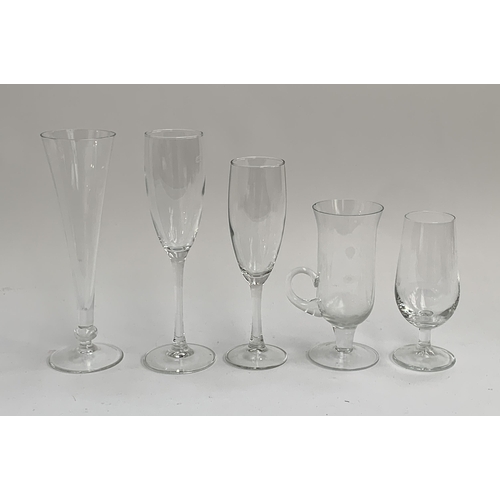 112 - A large quantity of champagne flutes, the tallest 21.5cmH, together with other assorted glasses (2 b... 