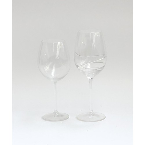 107 - A quantity of large wine glasses, two with incised swirl design (13 in total)