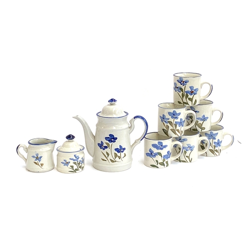 123 - A ceramic coffee set with hand painted floral design