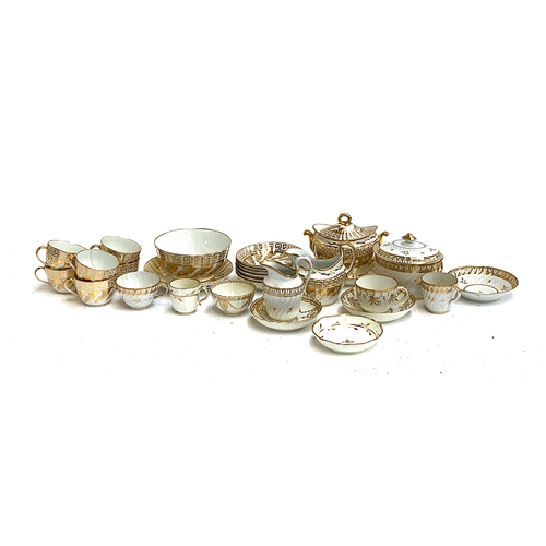 142 - A quantity of 19th century and later white and gilt teawares, to include a greek key pattern part te... 