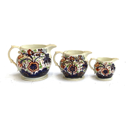 144 - A set of three graduating 19th century lustre jugs (af), 13cmH, 11cmH and 8cmH