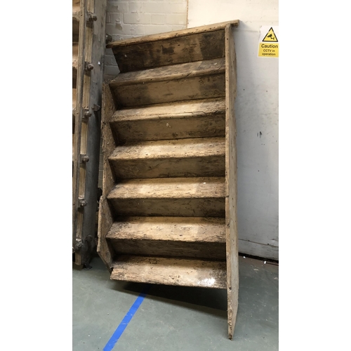 1066 - An 18th century elm staircase, ten steps, the base with a 45 degree curve, each tread 86cm wide