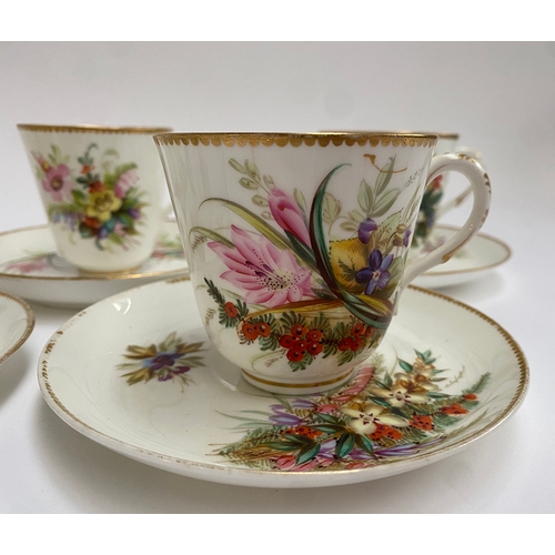 82 - A set of eight early 20th century hand painted porcelain coffee cups and saucers, floral spray desig... 