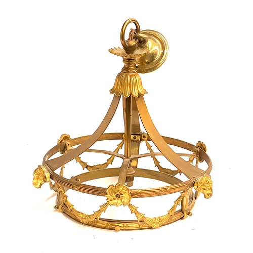 195 - A gilt metal hanging light with ram masks and bellflower swags, missing glass shade, 33cmD