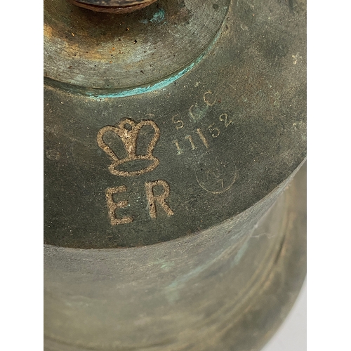 199 - A large metal bell, stamped SCC with E.R below a crown, 25cmD