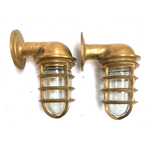 203 - A pair of heavy brass and moulded glass outdoor lights retailed by Ralph Lauren, approx. 22cmL