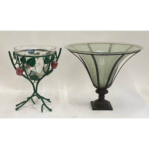 101 - A glass fruit bowl on a painted wrought metal stand, 37cmH, together with a large glass vase in a wr... 