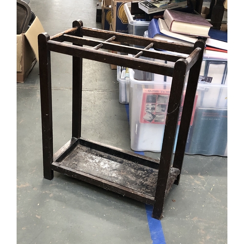 1040 - An oak stick stand with drip tray, 50x25x61cmH