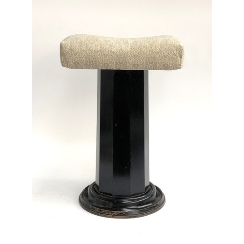 1098 - An upholstered dressing stool on an octagonal faceted column, 56cmH