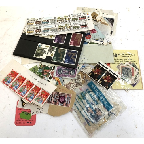 192 - A small quantity of commemorative and definitive stamps to include many unused small sections of she... 