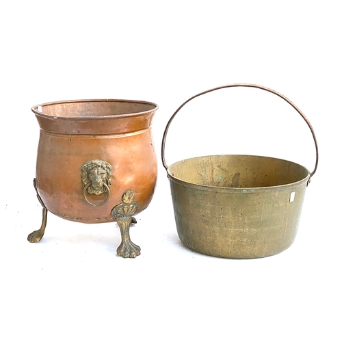1045 - A copper coal bucket with lion mask loop handles, 35cmH; together with a large brass saucepan