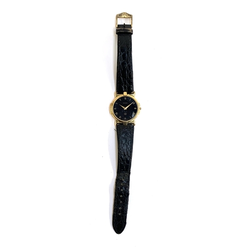 53 - A Gucci ladies watch model 3400 FM, gold tone with black dial and leather strap