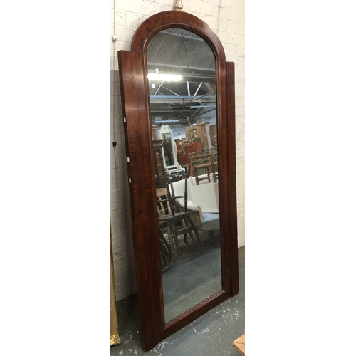 1069 - A mahogany domed long mirror (originally a wardrobe door), 210x94cmH