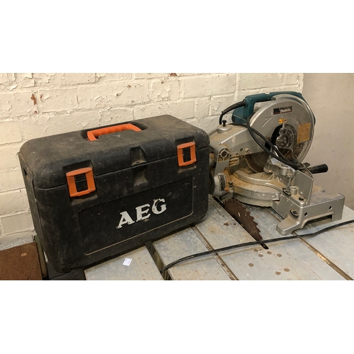 1079 - A Makita mitre saw; together with an AEG battery operated drill