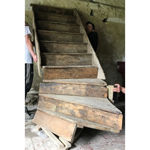 1066 - An 18th century elm staircase, ten steps, the base with a 45 degree curve, each tread 86cm wide