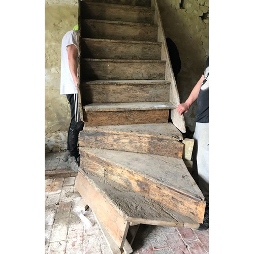 1066 - An 18th century elm staircase, ten steps, the base with a 45 degree curve, each tread 86cm wide