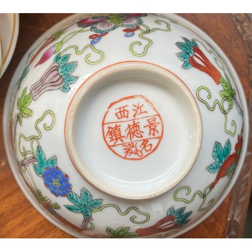 122 - A Chinese famille verte celadon plate, decorated with insects, precious objects and a phoenix, marks... 