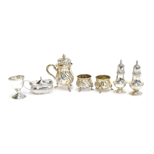 71 - A mixed lot of silver cruets, to include an .800 silver continental three piece set with spirally re... 