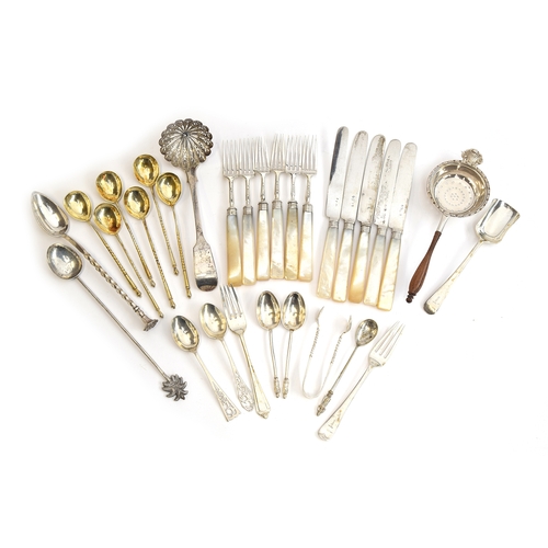 33 - A mixed lot of mostly silver flatware, to include a set of six mother of pearl handled fruit forks a... 