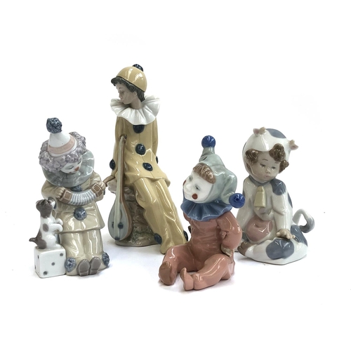 115 - Four Lladro figurines, three stamped Nao, to include child dressed as cow, no. 1415, child dressed a... 