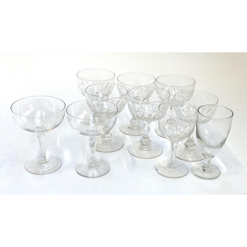 127 - A pair of hand blown champagne cups with cut faceted stems, together with a further set of six cut g... 