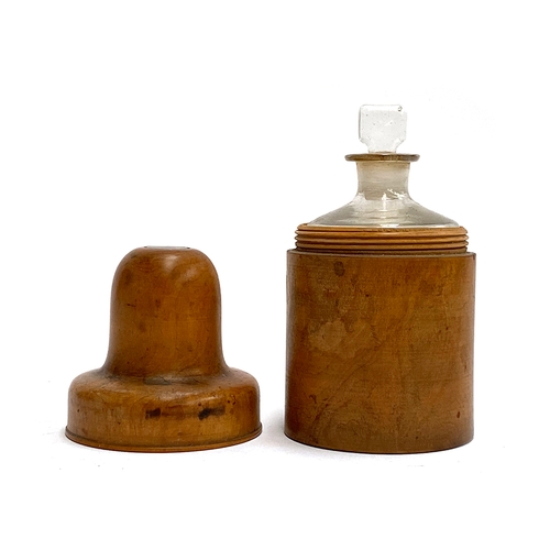 243 - A treen apothecary bottle holder with glass bottle and stopper, 13cmH