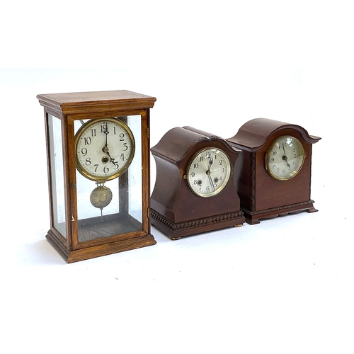 100 - Three early 20th century mantel clocks, one in a glass case, 30cmH