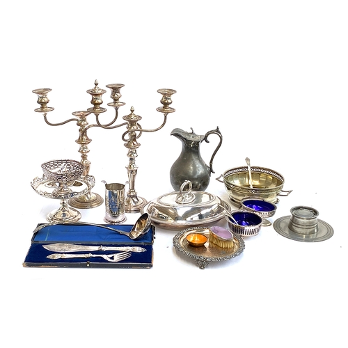 88 - A good lot of silver plated and metal items items to include a pair of two arm candlesticks; James D... 