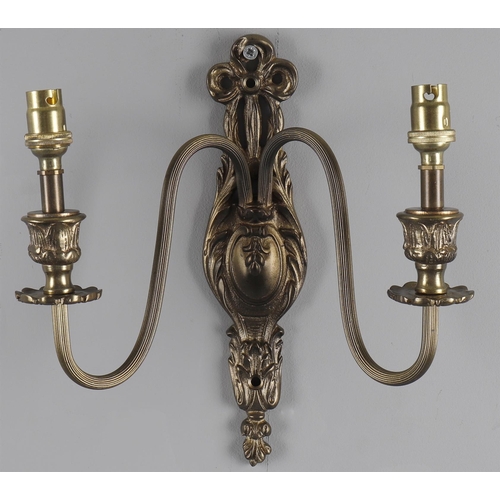 299 - A set of four gilt metal twin light wall appliques, in the 18th century French style, 20th century, ... 