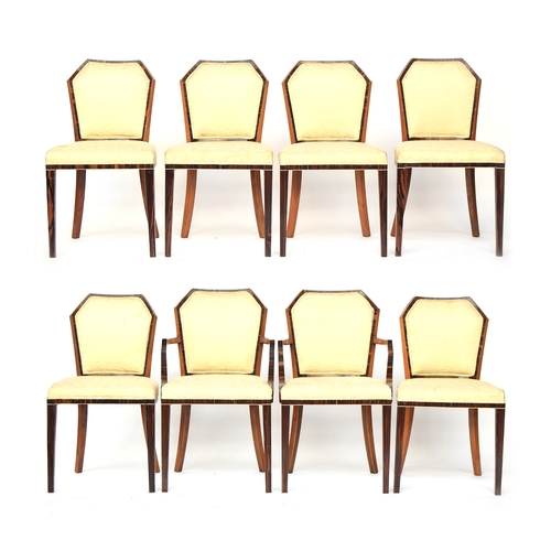 724 - A set of eight French Art Deco maccasar ebony veneer dining chairs, two carvers, mahogany framed, wi... 