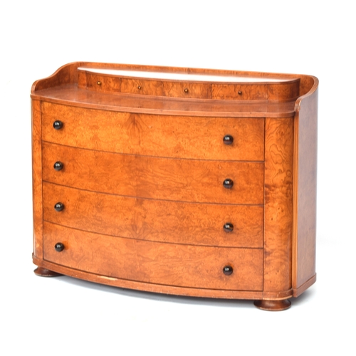 726 - An Austrian birch veneer bowfront commode, c.1935, the superstructure with four small drawers over f... 