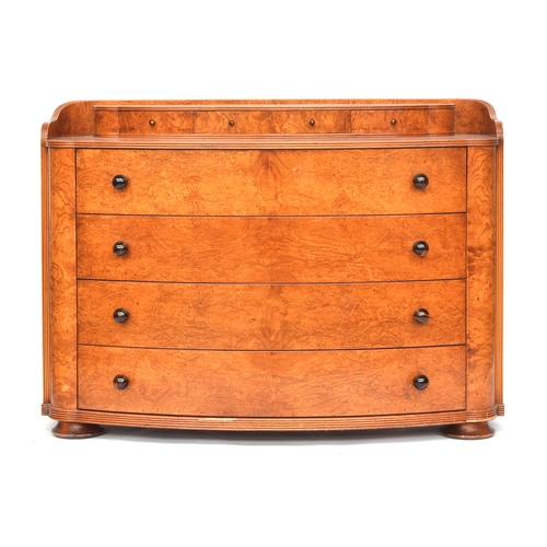 726 - An Austrian birch veneer bowfront commode, c.1935, the superstructure with four small drawers over f... 