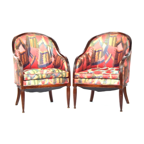 729 - A pair of French mahogany framed tub bergere armchairs in the manner of Sue et Mare, with arched swe... 