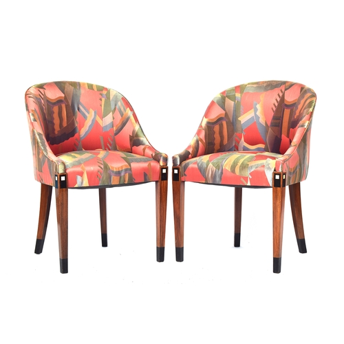 730 - A pair of French Art Deco tub chairs, raised on square tapered legs with ebonised and ivorine inlay,... 