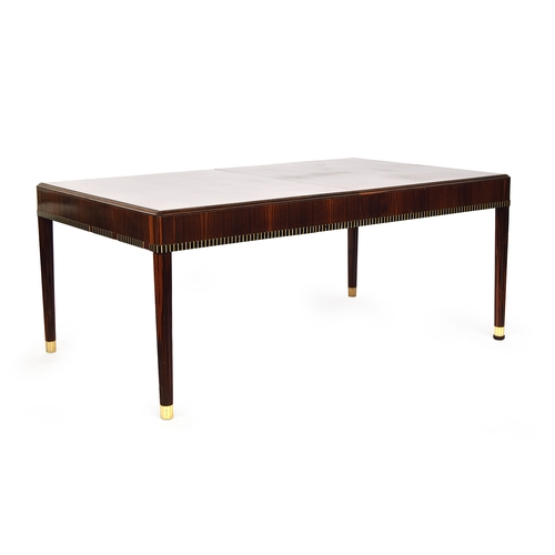 723 - A French Art Deco maccasar ebony dining table, rectangular moulded top, on fluted tapering legs, 176... 