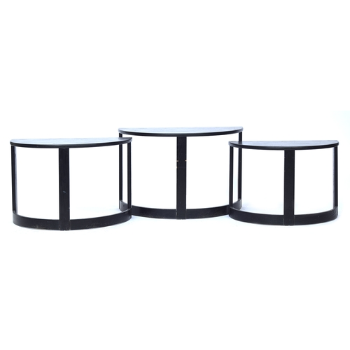 733 - Three black ash demilune nesting side tables, 74cm wide, 41cm deep, 48.5cm high