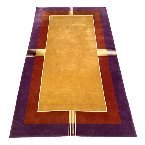 737 - A large thick wool Art Deco style rug, in yellow, red, and purple, 367x218cm