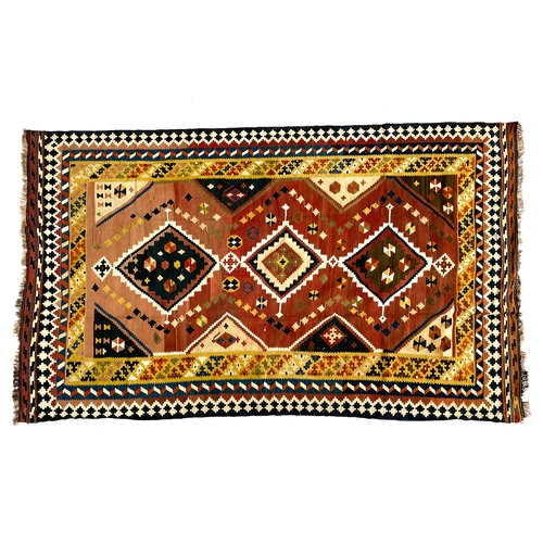 747 - A Qashqai kilim wool rug, yellow border, with three lozenges, 258x154cm