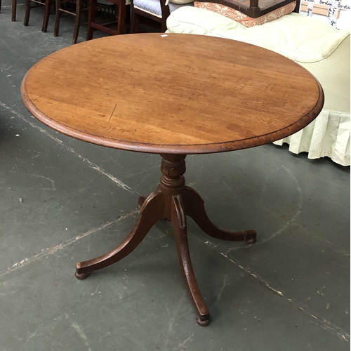 895 - An early 20th century oak tip top tripod table, on four swept legs, 92x72cmH