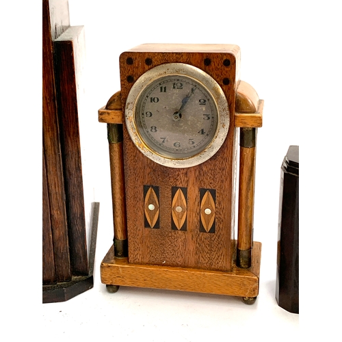 104 - An Art Deco style mantel clock; a smaller bakelite mantel clock; a small oak and marquetry mantel cl... 