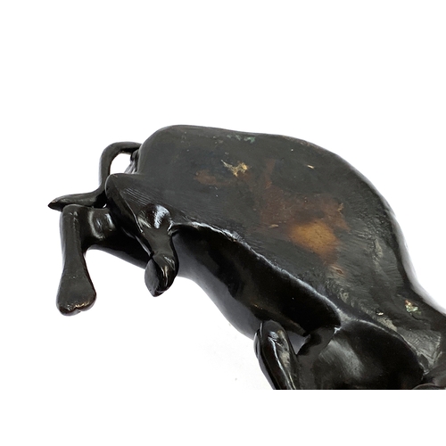 312 - A bronze figure of a water buffalo, approx. 24cmL