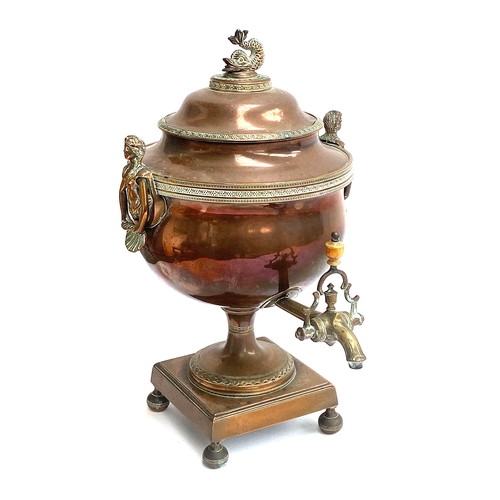 377 - A 19th century copper and brass samovar with dolphin finial and mermaid handles, 37cmH